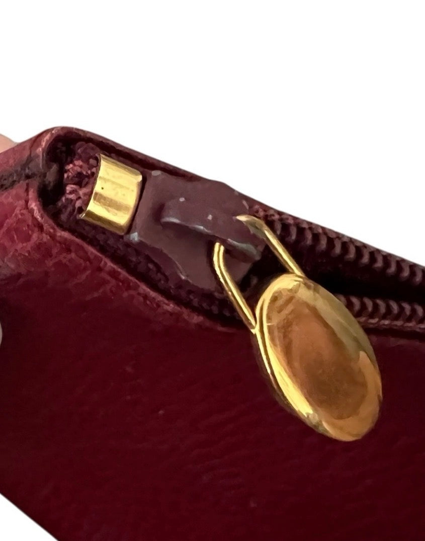 Cartier Must de Cartier burgundy leather zip pouch/clutch