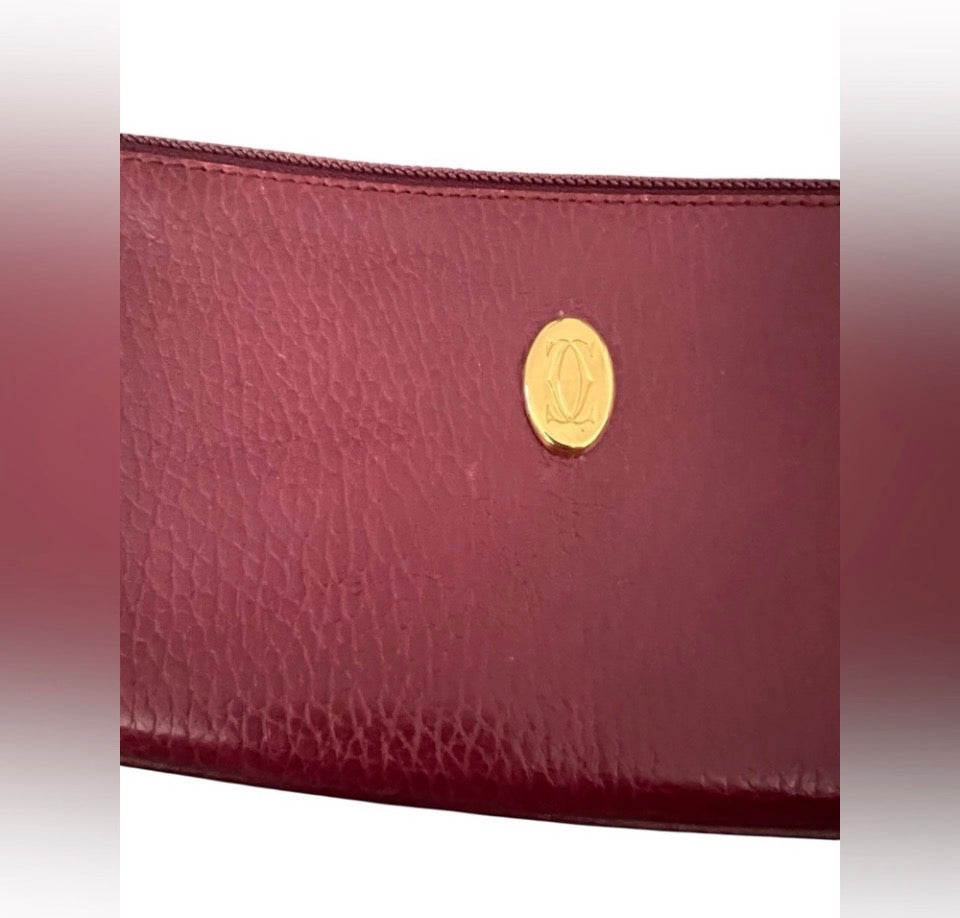 Cartier Must de Cartier burgundy leather zip pouch/clutch