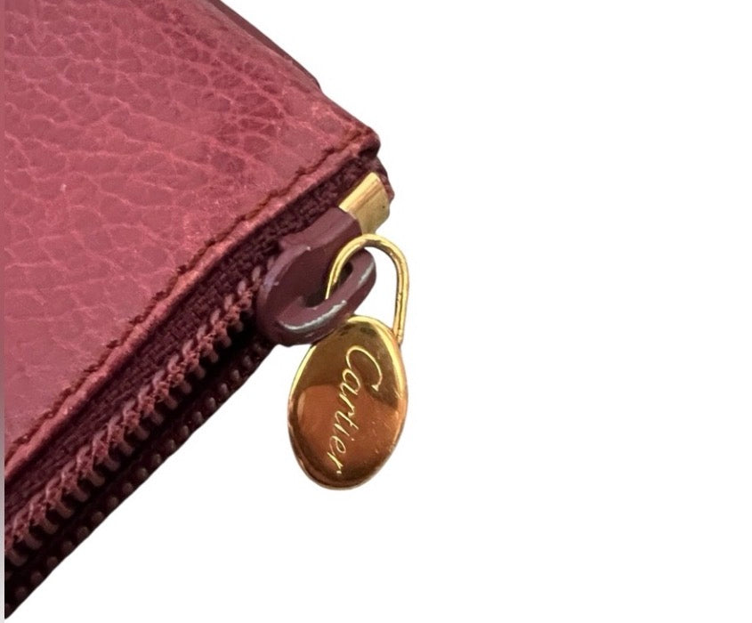 Cartier Must de Cartier burgundy leather zip pouch/clutch