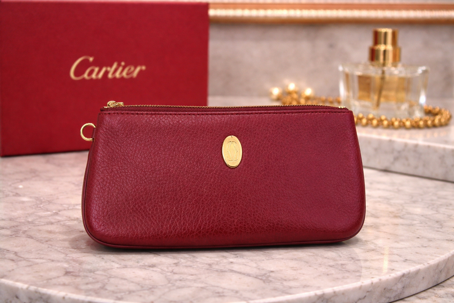 Cartier Must de Cartier burgundy leather zip pouch/clutch